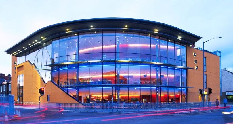 ARC in Stockton, a glass fronted building lit purple from inside