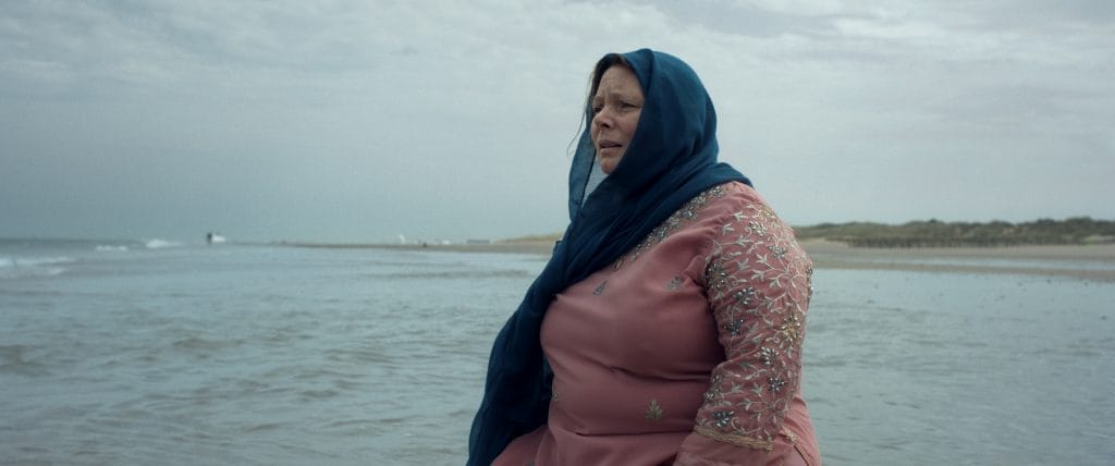 Woman standing on a beach