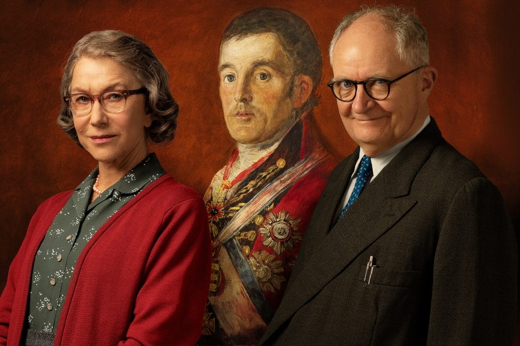 Helen Mirren and Jim Broadbent sit with a painting of The Duke in the background.