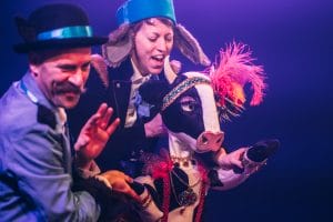 Jeremy and Hannah on stage with the 'cow that jumped over the moon' puppet