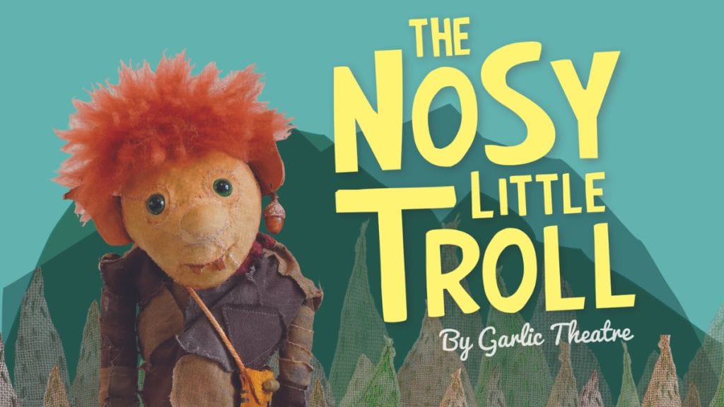 Image of The Nosy Little Troll puppet with trees and mountains in the background. Text: The Nosy Little Troll By Garlic Theatre