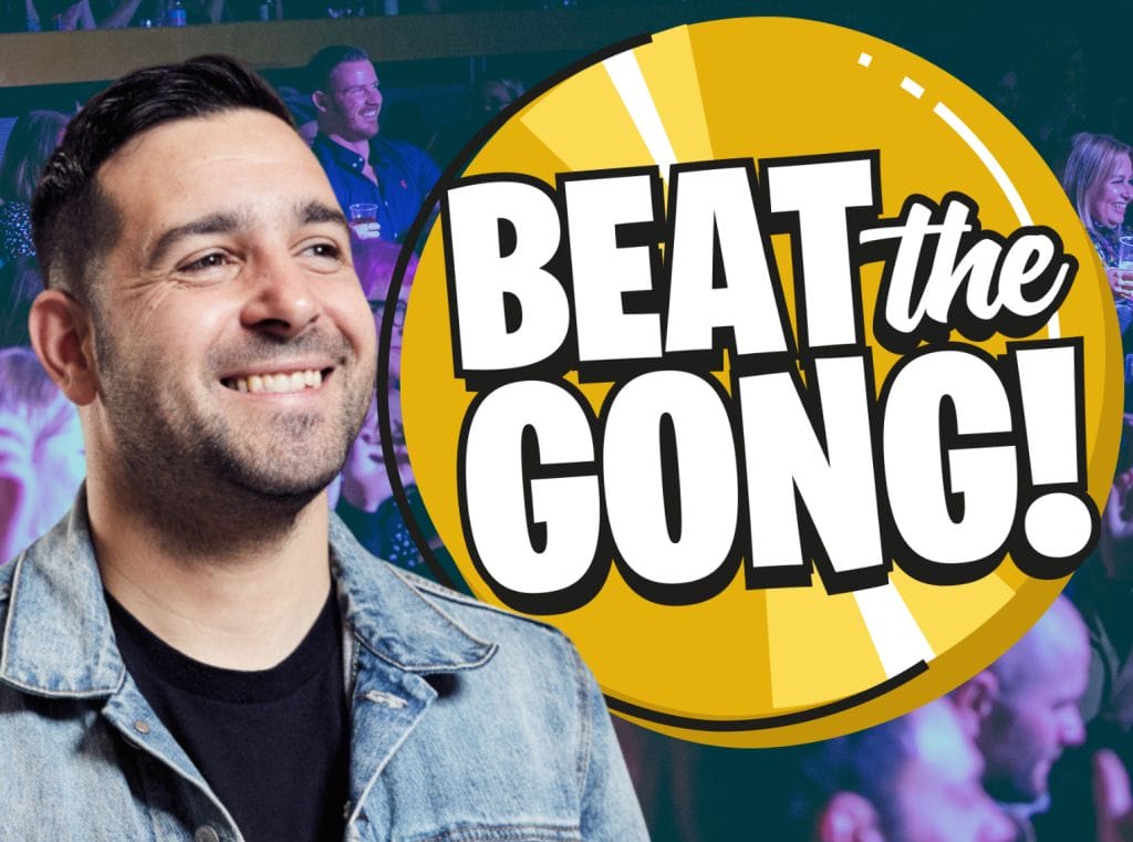 Comedian Danny McLoughlin, a white man with short, dark brown hair, stands smiling next to an animated Beat the Gong logo.