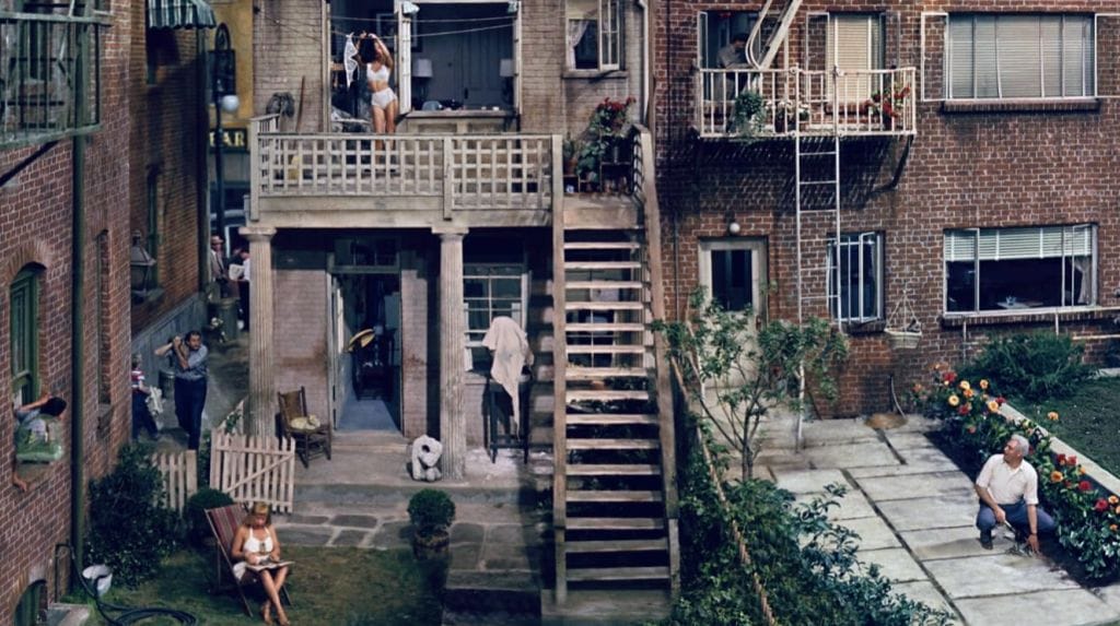 A wide shot of the housing estate with tenants going about their everyday business.