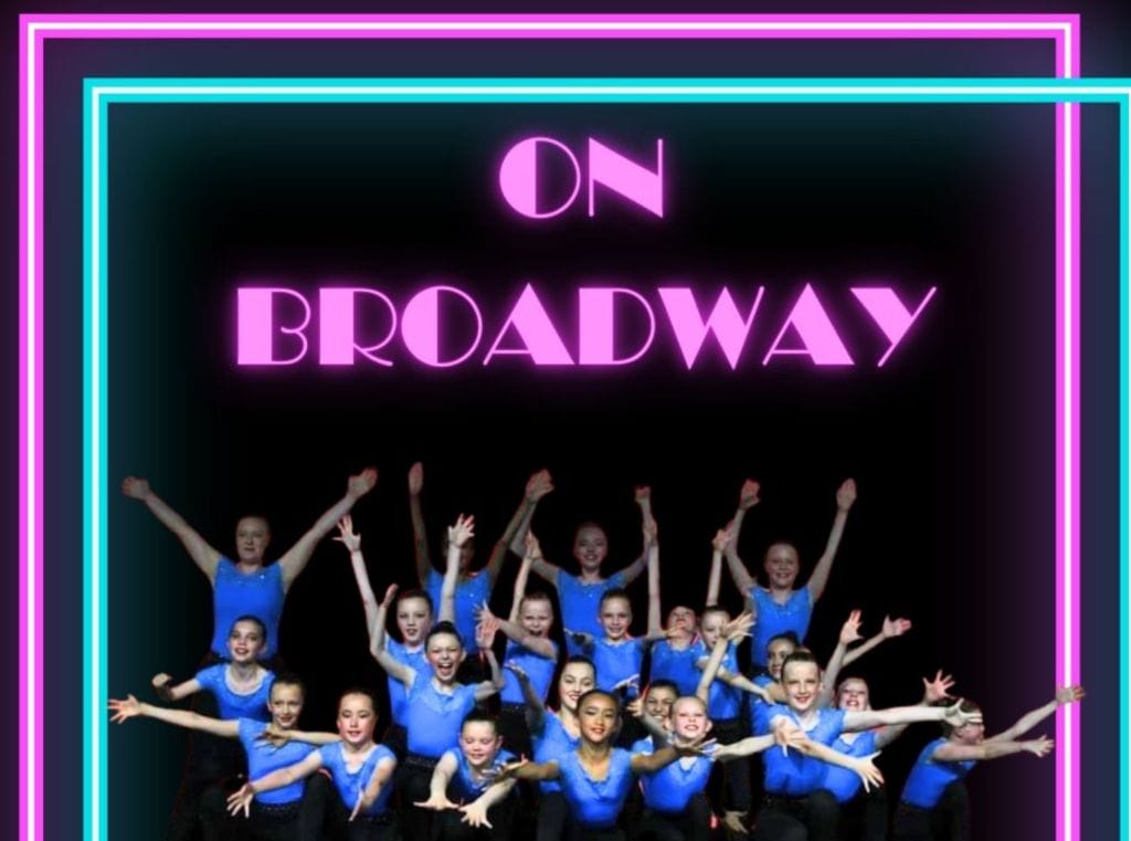 Black background with neon pink and blue border. Neon Pink On Broadway text with several female dancers dressed in blue