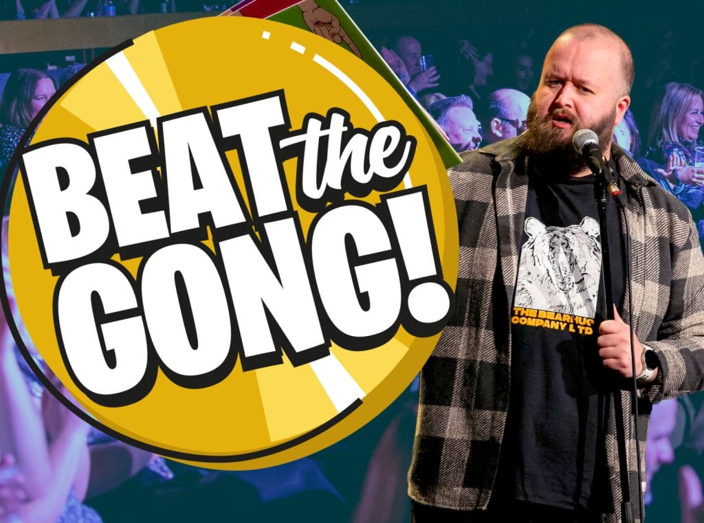 Comedian Freddy Quinne standing to the right of an animated Beat the Gong logo.