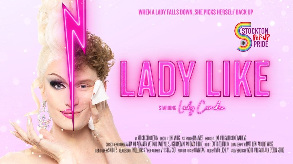 Pink background and Lady Like in pink text. A image of Lady Camden a drag queen, right half of a face natural a male with ginger curly hair separated by a lightning bolt and the left side is in drag make up, with white blonde hair. Image also shows the Stockton Pop-Up Pride logo.