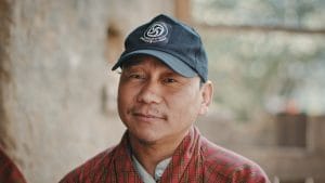 Portrait of Amber. A Asian man wearing a Blue cap