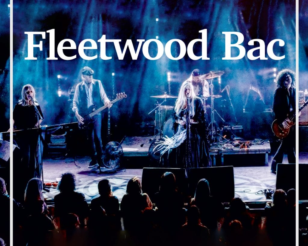 Live concert photo of Fleetwood Mac tribute band "Fleetwood Bac" performing on stage. Five musicians visible, replicating the classic Fleetwood Mac lineup. Stage bathed in blue lighting. Band name "Fleetwood Bac" displayed at top. Silhouettes of audience members visible in foreground.