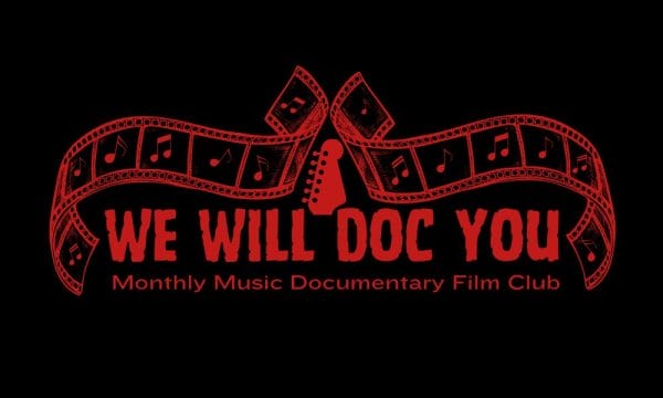 We Will Doc You logo shows the text We Will Doc You with film strips musical notes and a guitar head as decoration, the tagline reads Monthly Music Documentary Film Club.