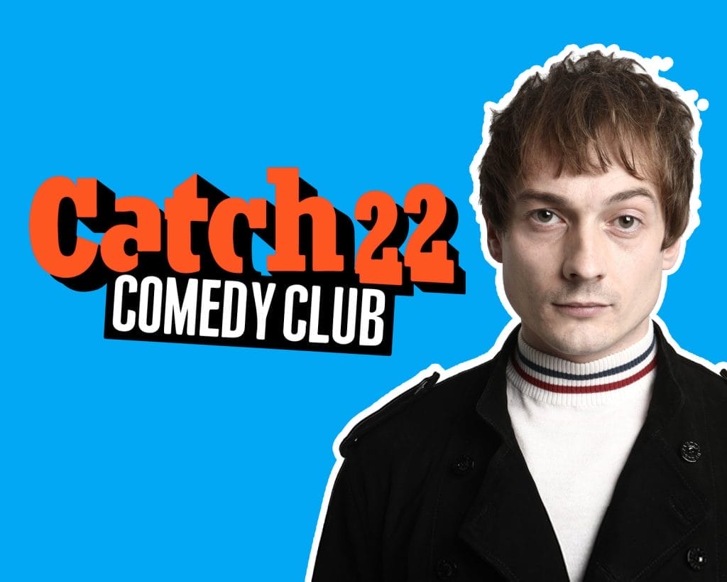 Comedian Matt Bragg, a young white man with short brown hair, stands alongside an orange Catch 22 Comedy Club logo.