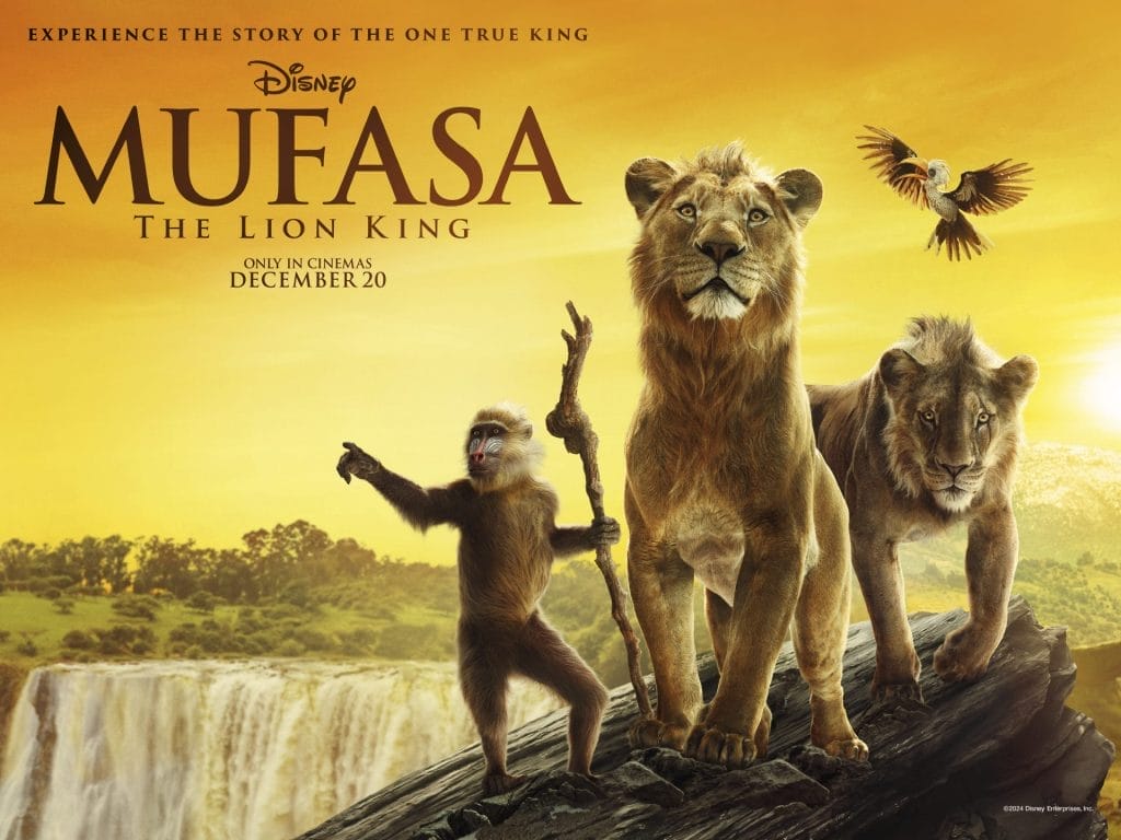 Two lions, and a baboon holding a wooden staff, stand on the edge of a sharp cliff. Text reads: experience the story of the one true king, Mufasa The Lion King