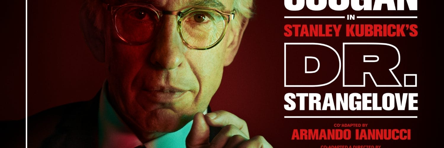 A close up headshot of actor Steve Coogan portraying Dr Strangelove. In the top left corner is a white National Theatre Live logo. To the right is text that reads Steve Coogan in Stanley Kubrick's Dr. Strangelove.