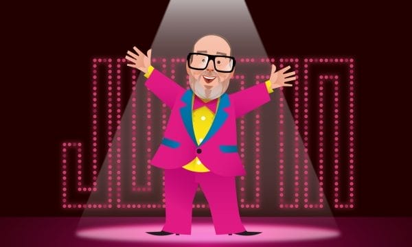 A 2D cartoon of a bald man wearing glasses in a pink suit with his arms outstretched. there is a spotlight on him and in the background show lights spell out the word 'Justin'