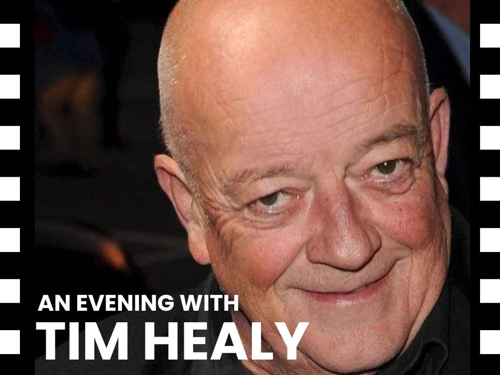 An image of actor Tim Healy smiling.