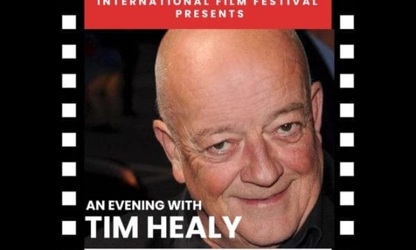 An image of actor Tim Healy smiling, with a black and white film reel boarder. At the top there is a red and white title that says 'Tees Valley International Film Festival Presents' at the bottom in white it says 'An Evening with Tim Healy' in a white boc at the bottom with black writing it says 'ARC Stockton 6th November 2025'