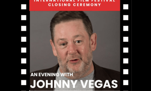 An images of actor Jonny Vegas looking at the camera with a beige background with the text stating 'an evening with Jonny Vegas' with the boarder with black and white in a film reel style.