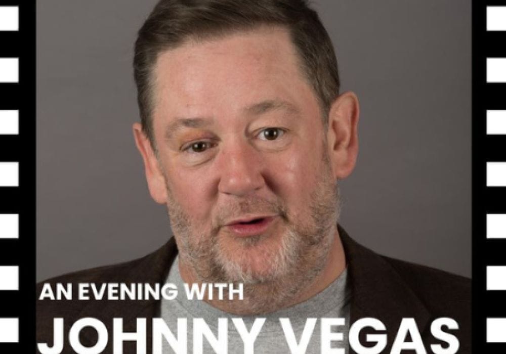 An images of actor Jonny Vegas looking at the camera with a beige background with the text stating 'an evening with Jonny Vegas' with the boarder with black and white in a film reel style.
