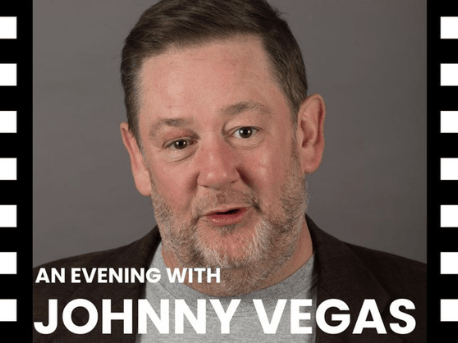 An images of actor Jonny Vegas looking at the camera with a beige background with the text stating 'an evening with Jonny Vegas' with the boarder with black and white in a film reel style.