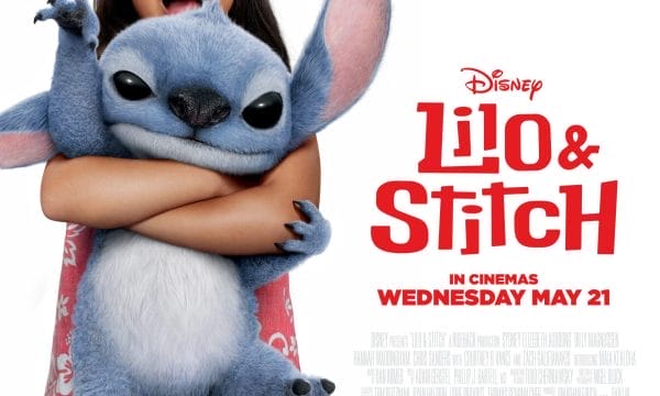 the beloved blue alien character Stitch being hugged by a young girl (Lilo) who has a plumeria flower in her hair. The poster indicates the film was released in cinemas on Wednesday, May 21st.