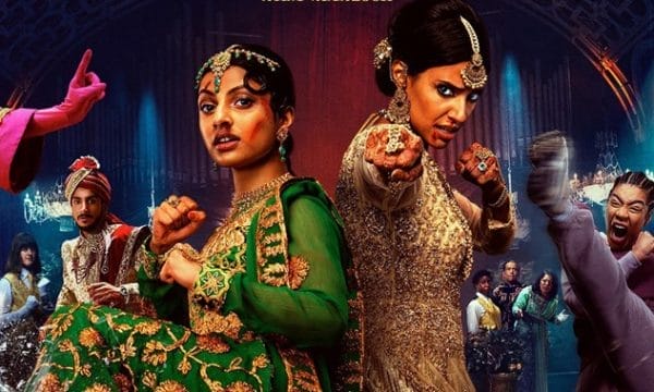Vibrant, colourful imagery with what appears to be characters in elaborate costumes - some in traditional South Asian attire with ornate jewellery and embroidery, and others in more contemporary dress. The styling suggests this might be a comedy or musical film that blends traditional and modern elements.