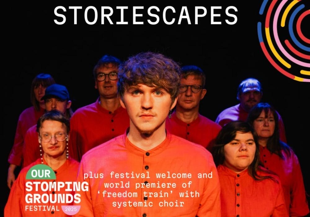 A young man stands in the middle of a group of people wearing red clothing. The white text Storiescapes is in large letters across the top of the image.