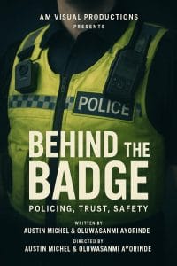 An image on a police persons torso wearing a fluro police vest with Behind the Badge Police, Trust, Safety in white text.