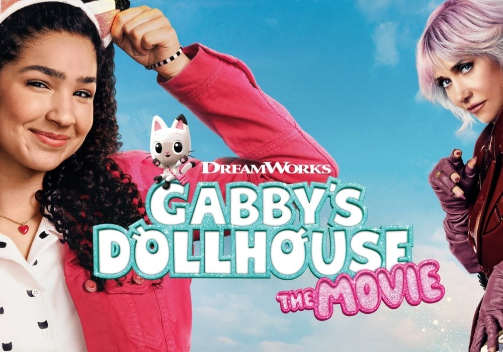 A young girl with brown curly hair wearing a cat ears hair band smiling standing next to a sinister blond haired woman dressed in red leather jacket