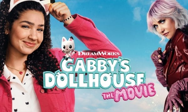 A young girl with brown curly hair wearing a cat ears hair band smiling standing next to a sinister blond haired woman dressed in red leather jacket