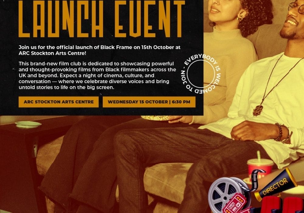 Black Frame launch event. A male and female sat on a sofa looking up as if they are looking at a screen