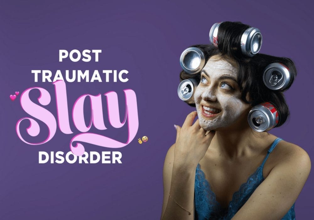 A woman with a face mask and Coke cans in her hair poses playfully against a purple background with the words 'Post Traumatic Slay Disorder.'