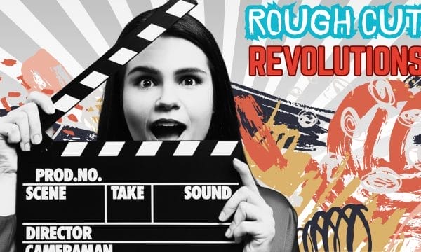 A female actor holding a clapper board