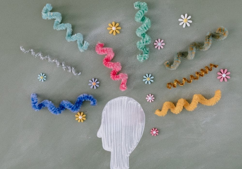 An illustration on a head with fabric brainwaves radiating from it.