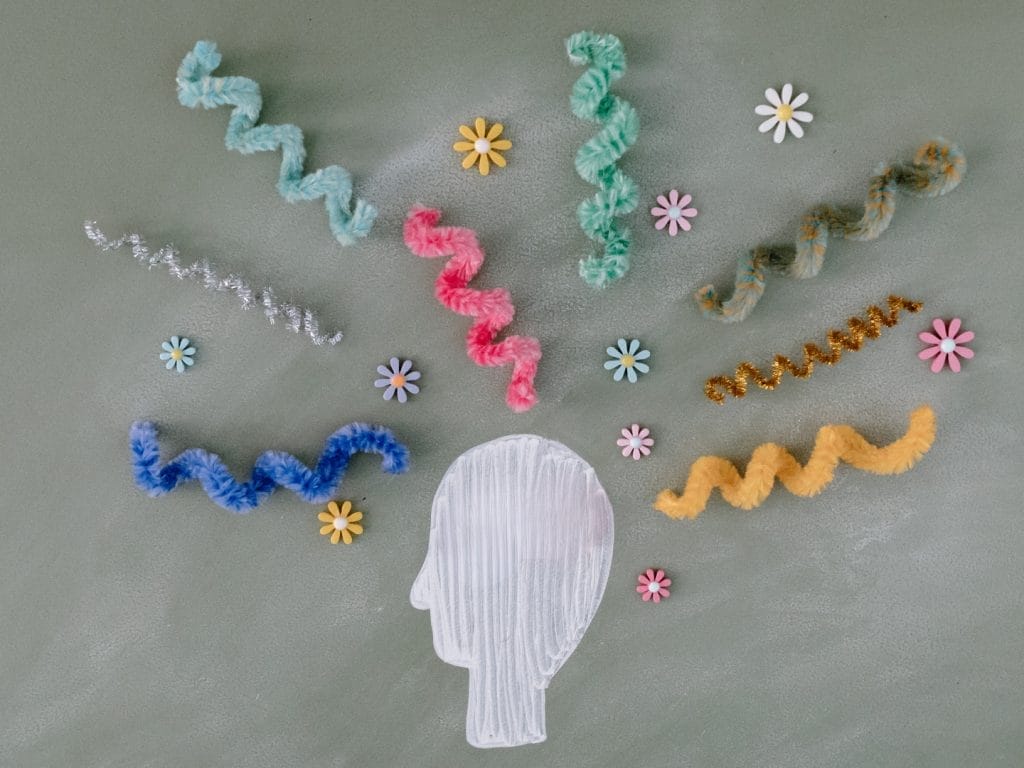 An illustration on a head with fabric brainwaves radiating from it.