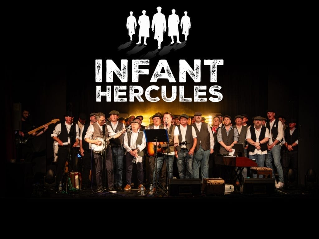 A male choir group on stage