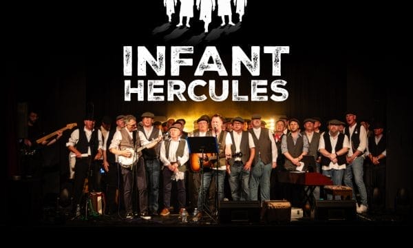 A male choir group on stage