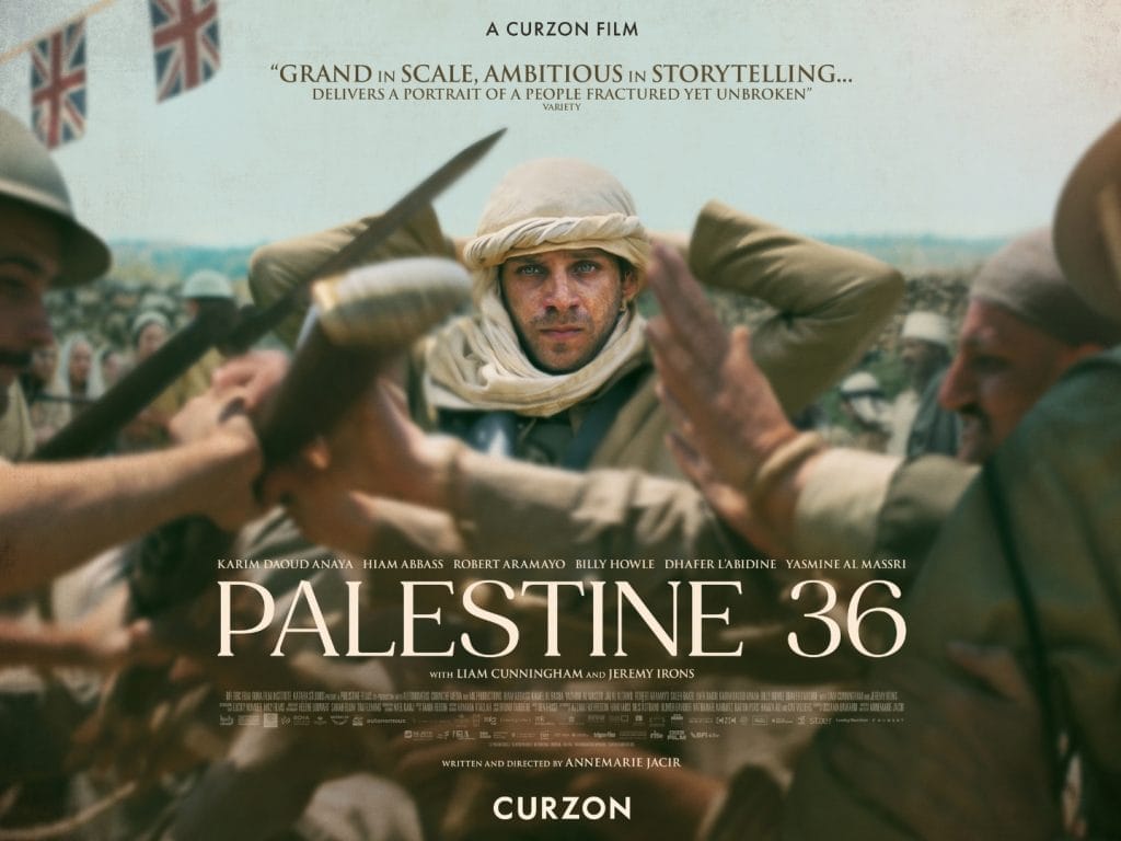 A man wearing arabic clothing surrounded by hostile people