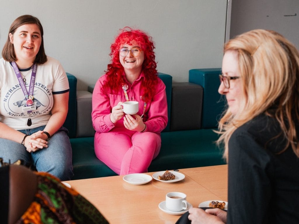 A group of community creative artists having a meeting