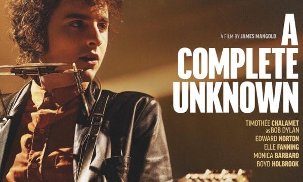 An actor playing the part of folk musician Bob Dylan